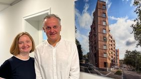  Geschäftsführung der Freiburger Stadtbau vor dem Bild des Rennwegdreiecks